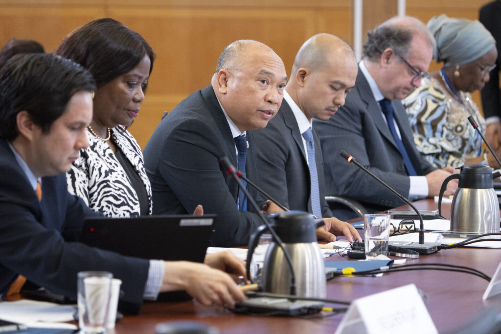 Group of people at a conference table.