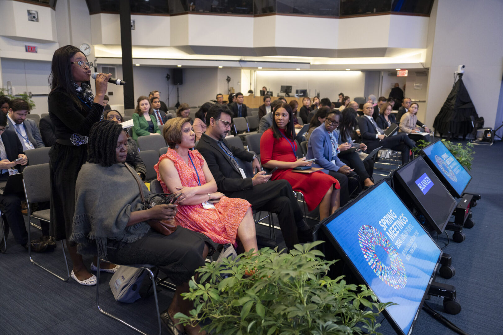 Audience listening to speaker at IMF Spring Meetings.